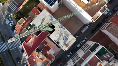 Top down drone view of construction crane over city in Torrevieja Stockbeeldmateriaal 340337304