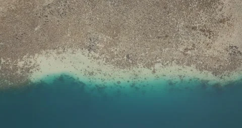 Top-down drone view of coral reef and turquoise lagoon in West Bali National 스톡 동영상 331104304