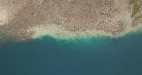 Top-down drone view of coral reef and turquoise lagoon in West Bali National 스톡 동영상 331105298