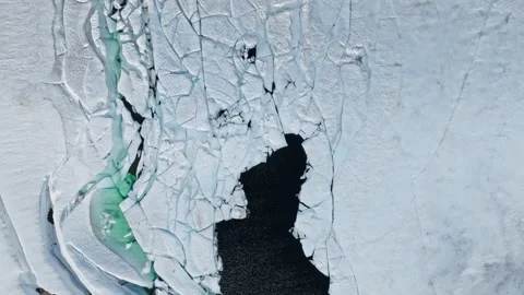 Top-down drone view of cracked lake ice on Hardangervidda National Park. Stock Footage 328130815