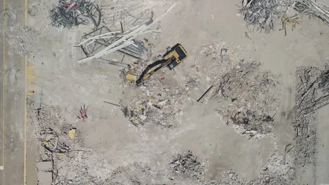 Top down drone view of destroyed site. Equipment that destroys buildings. Stock-Footage 291601757