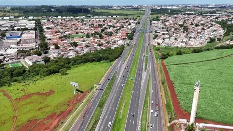 Top Down Drone View of Divided Highway and Urban Outskirts Stock Footage 326018700