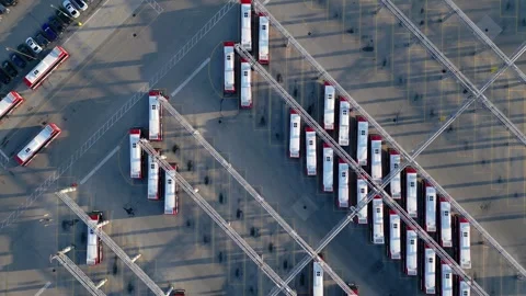 Top down drone view of electric buses and charging stations at public transit Stock Footage 305653898