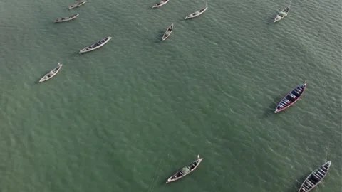 Top-Down Drone View of Empty Fishing Boats Floating Offshore, Gambia Video stock 317173551