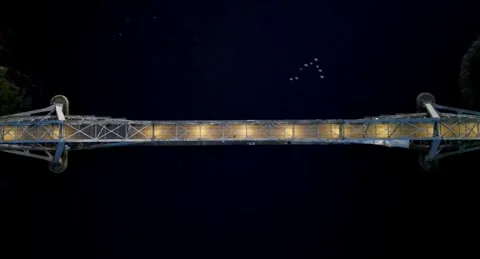 Top down drone view of floodlit Connel Bridge at night near Oban Stock Footage 330590801