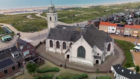 Top-down drone view of a fortress-like historic church with a unique roof Stock-Footage 314279323
