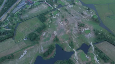 Top down drone view of golf course with ponds and sand bunkers Stock Footage 343839814