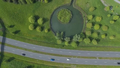Top down drone view of green park with ponds and winding paths Video stock 337351201