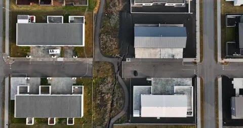 Top-down drone view in Grindavik, Iceland, showing a long fracture zone beside Vídeo Stock 345994707