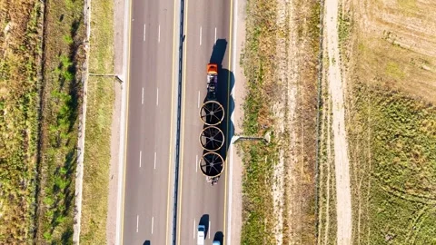 Top Down Drone View of Heavy Haul Truck Transporting Oversized Industrial Equipm Stock Footage 340236778