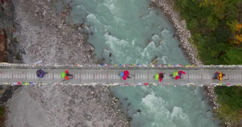 Top down drone view of Hillary Bridge Nepal showing trekkers crossing over Stock Footage 339027780