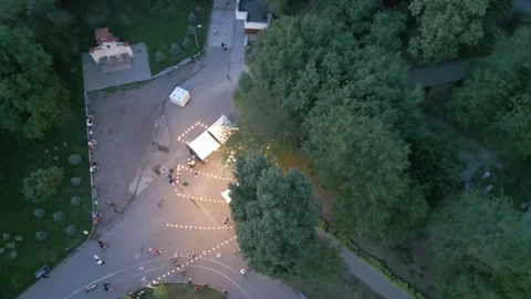 Top Down Drone View of Illuminated Park Plaza at Dusk Stock Footage 341767616
