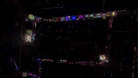 Top down drone view of illuminated fairground at night Видео 345255751