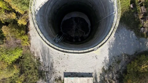 Top-Down Drone View of Industrial Water Tower with Flowing Water Stock Footage 323229148