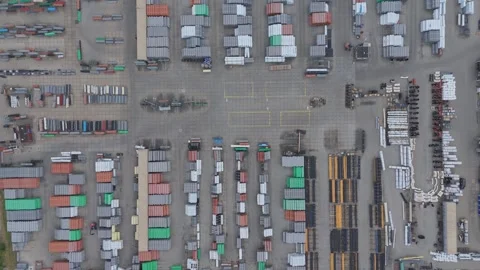 Top down drone view of industrial storage yard with building materials Stock Footage 343838262