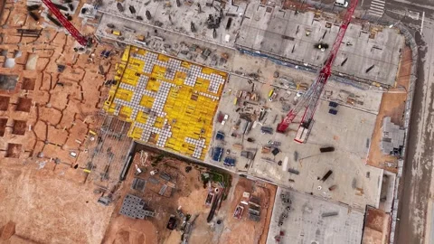 Top down drone view of large construction site with tower crane Stock Footage 345568781
