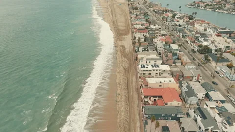 Top down drone view of Long Beach coast where ocean waves approach Stock-Footage 347620904