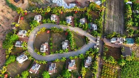 Top Down Drone View of Luxury Villa Resort with Palm Tree Landscape Stock Photos