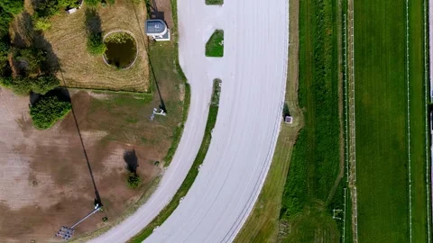 Top-down drone view of a Milan racecourse track curve, showing detailed layout Stock Footage 321669953