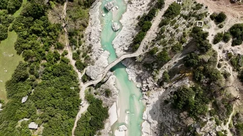 Top Down Drone View of Mountain River Flowing Through Canyon Stock Footage 332059615