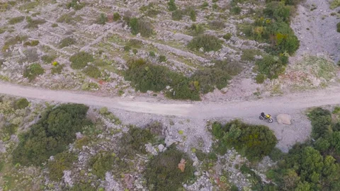 Top Down Drone View of Mountain Road, Tent and Motorcycle Stock Footage 337770391