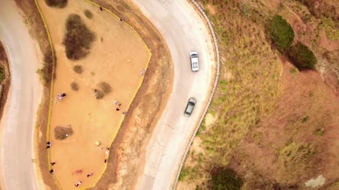 Top Down Drone View of Mountain Road and Hillside Stock Footage 337783997