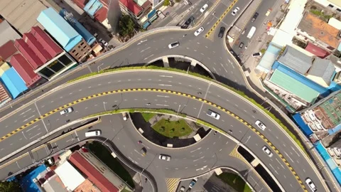 Top-down drone view of a multilevel flyover interchange in Phnom Penh Stock Footage 346017561