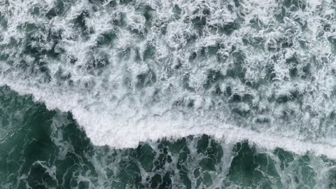Top down drone view of ocean waves on New Zealand North Island coast Video stock 339017856