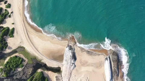 Top Down Drone View of Ocean Waves Breaking Over Rocky Coast at Okanda Sri L Stock Footage 339291318