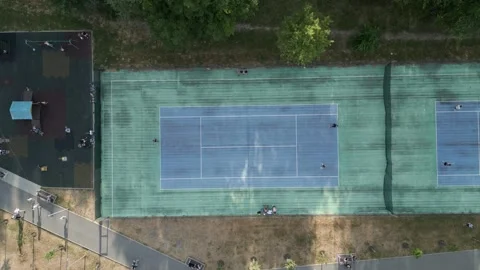 Top down drone view of outdoor tennis courts in sports complex Video stock 341824312
