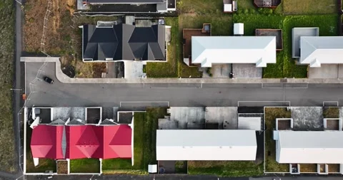 Top-down drone view over Grindavik, Iceland, showing a quiet residential street Stock Footage 346179180