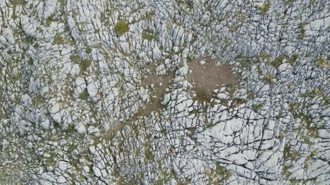 Top Down Drone View of Person Walking Among Mountain Rocks Stock Footage 320963855