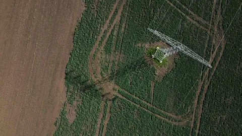 Top Down Drone View of Power Pylon in Agricultural Field – 4K Stock Footage 341850309
