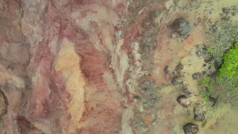 Top-down drone view of red and ochre eroded earth texture in Hawaii Stock-Footage 347825897
