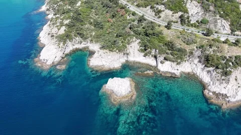 Top Down Drone View of Rocky Cove and Clear Water Stock Footage 333046223