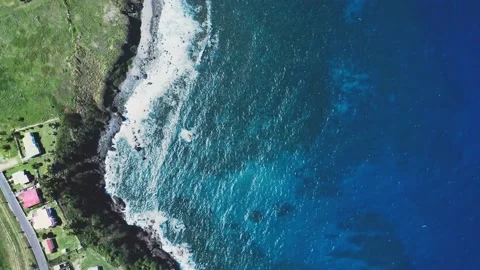 Top-down drone view of rooftops on the cliff, the blue sea foaming Video stock 136404115