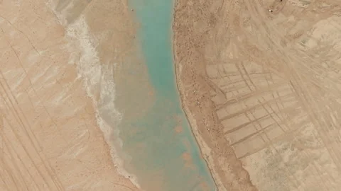 Top down drone view of shallow water channel surrounded by sand barriers 库存影片 347508423