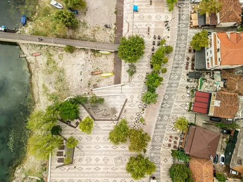 Top Down Drone View of Shiroka Promenade Dock and Restaurants Albania Stock Photos
