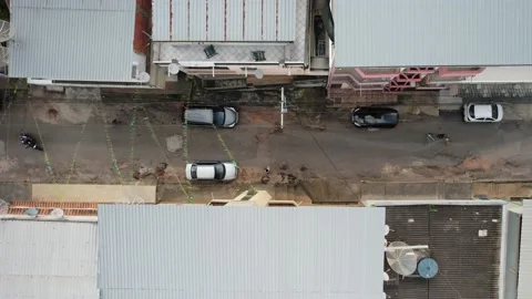 Top down drone view sideways tracking an unidentifiable person on a motorbike Stock Footage 228742170