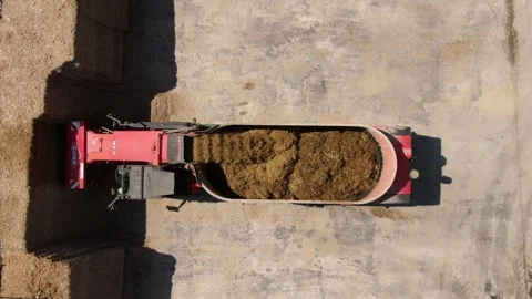 Top down drone view of silage loading machine Video stock 333278316