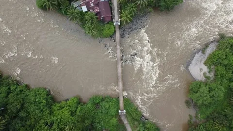Top-Down Drone View of Small Bridge Over River in Rural Village Video stock 197998659