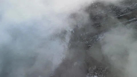 Top Down Drone View of Snowy Canyon and River Hidden by Fog Vidéo 340324376