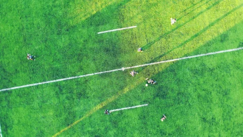 Top-down drone view of soccer kickoff with players on field aerial rising an 4k Stock Footage 315814239