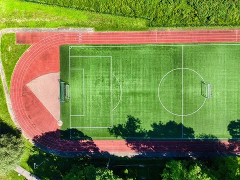 Top Down Drone View of Soccer Field and Running Track Stadium Stock Photos