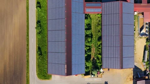 Top down drone view of solar panels on large farm barn roofs Stock Footage 337910560