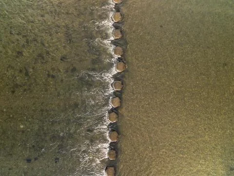 Top Down Drone View of Stepping Stones in Flowing River Stock Photos