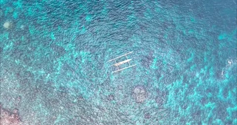 Top Down Drone View of Traditional Boat Over Coral Reef in Amed Bali Stock Footage 334372642