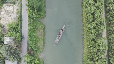 Top Down Drone View of Traditional Boat on Rural Canal in Bangladesh Stock Footage 337059902