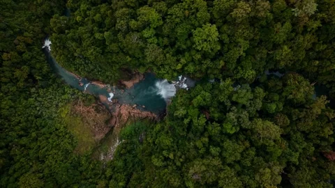 Top Down Drone View of Tropical Waterfall Jungle River in Karawawi West Papua Stock Footage 334846823
