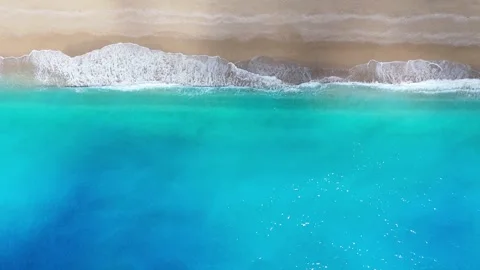 Top Down Drone View of Turquoise Waves Breaking on Beach in Lefkada, Greece Stock Footage 345433713